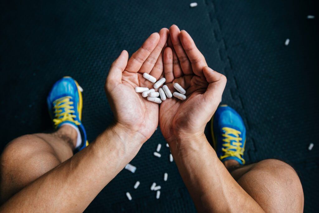 an athelete takes pills

