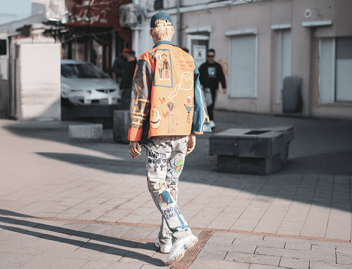 Man walking on plaza wearing vintage clothes